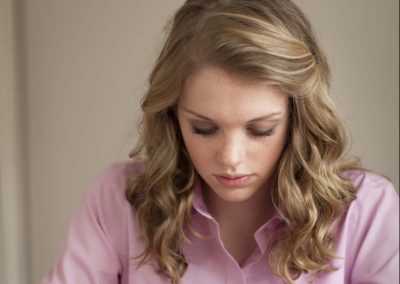 Girl Taking Notes on Scriptures